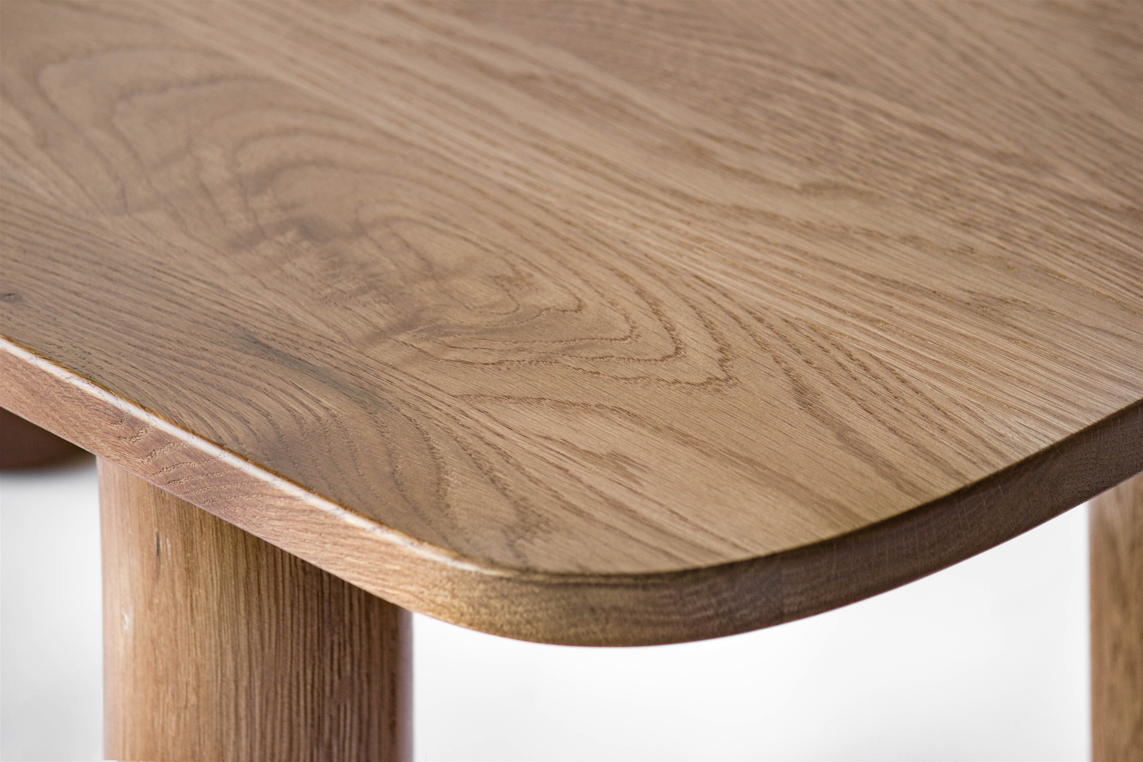 a close up of a wooden table with a white background