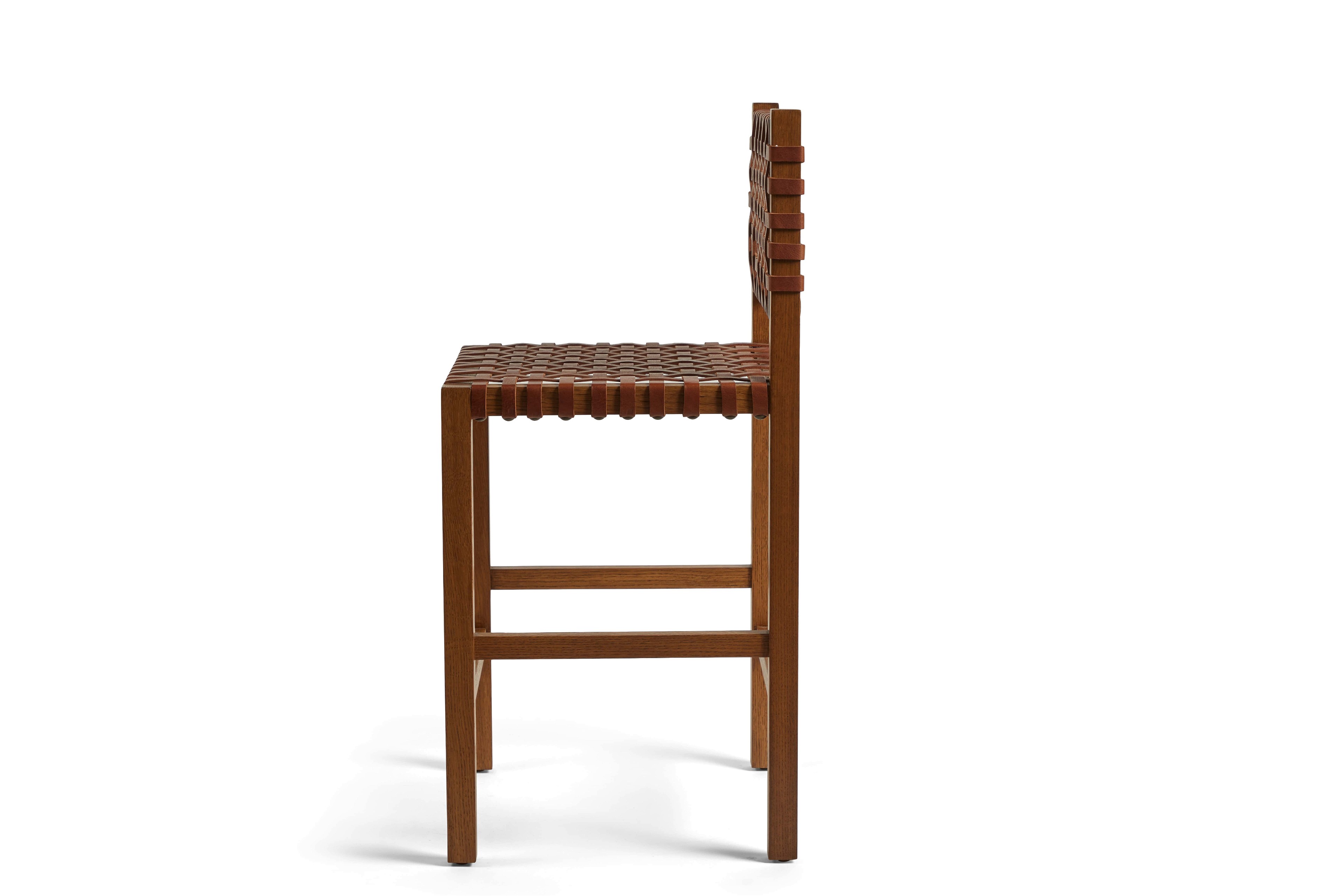a wooden bar stool with a leather seat