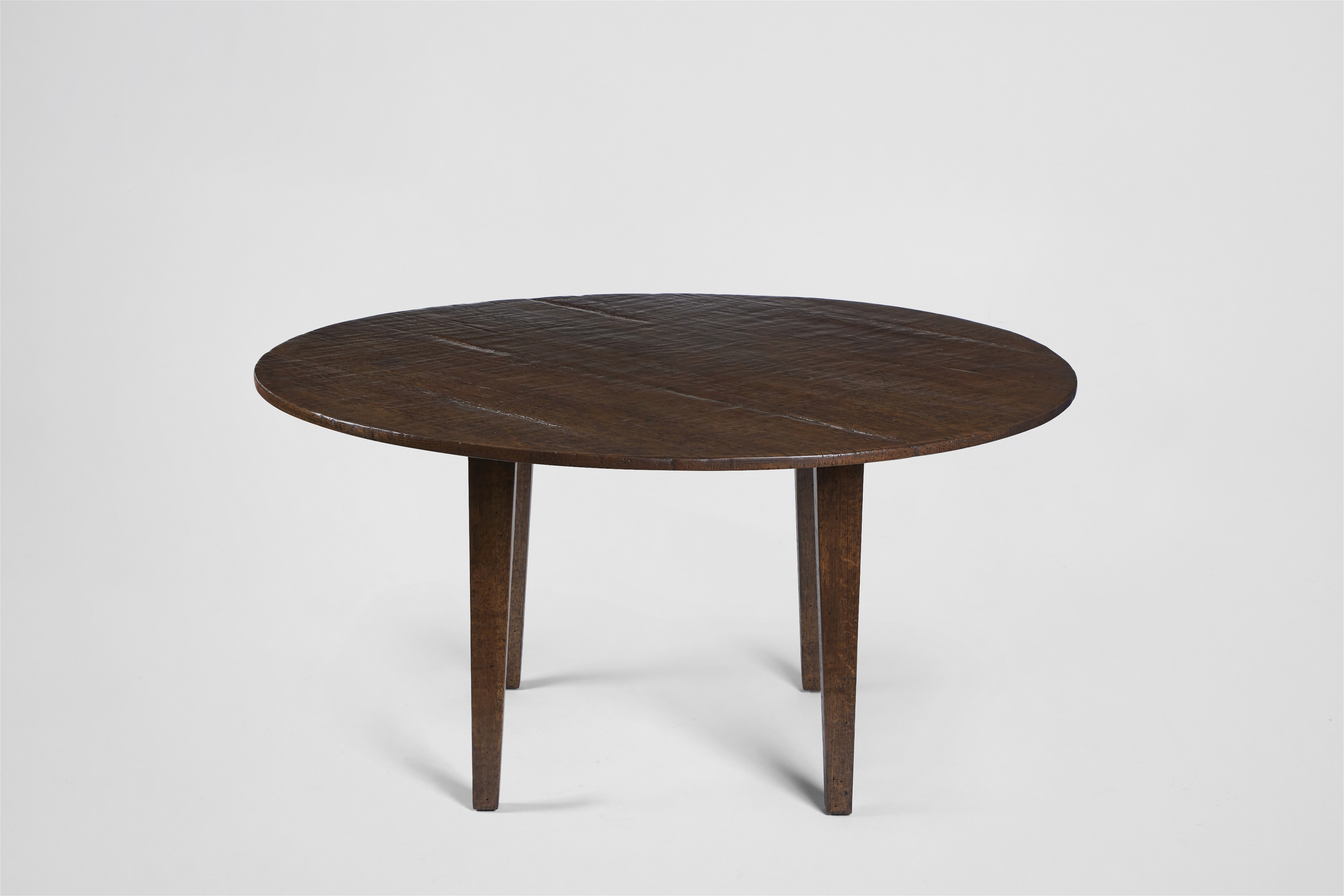 a round wooden table with two legs