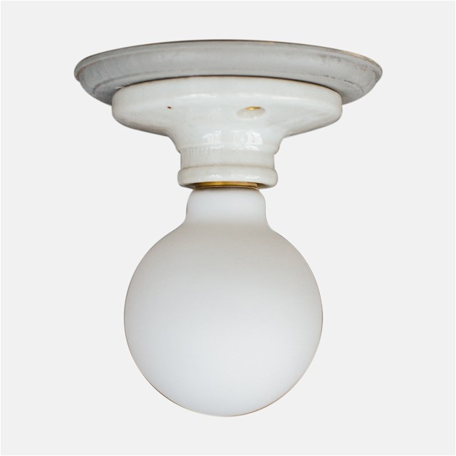 a close up of a light fixture on a white background