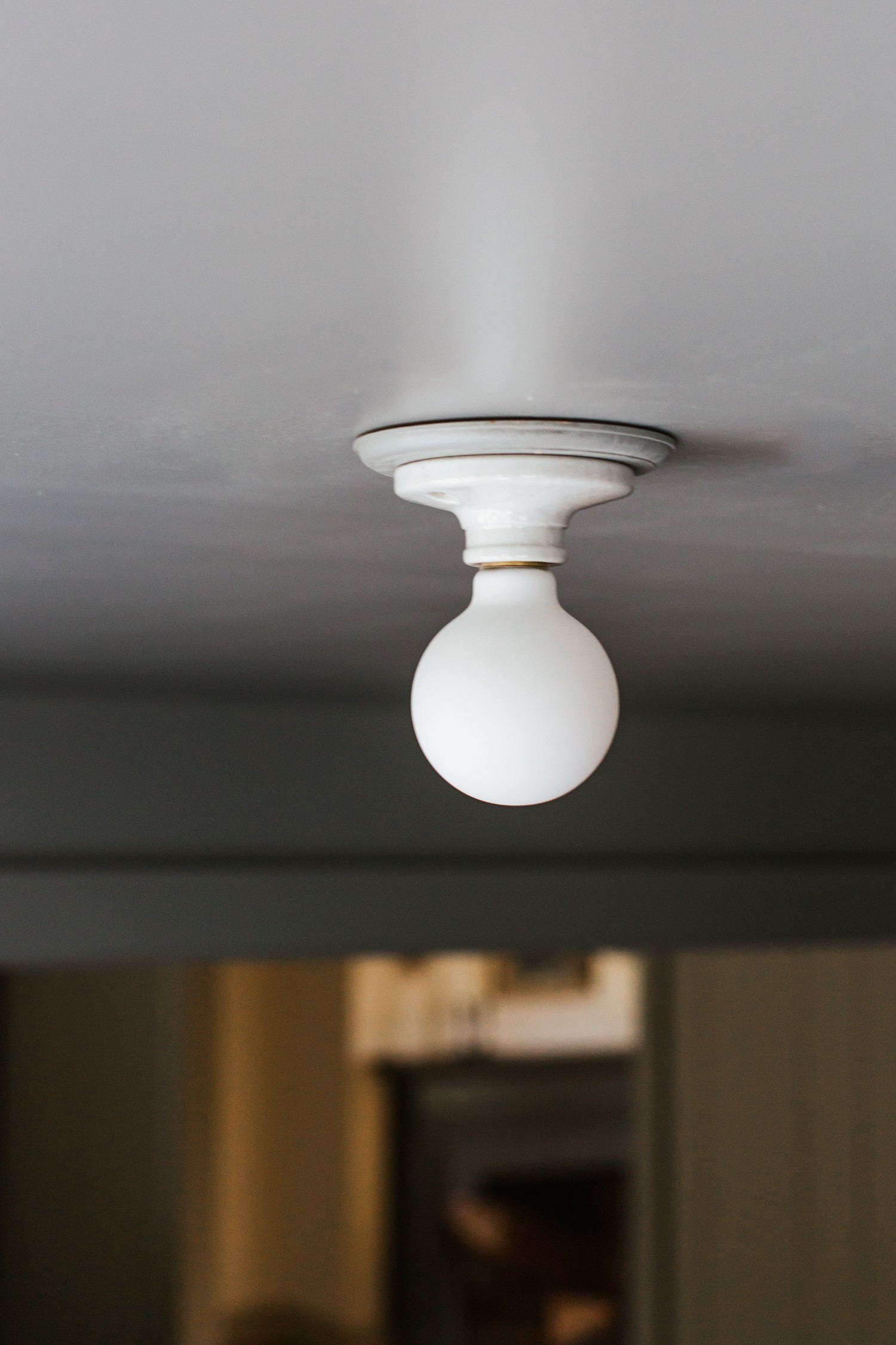 a close up of a light fixture on a ceiling