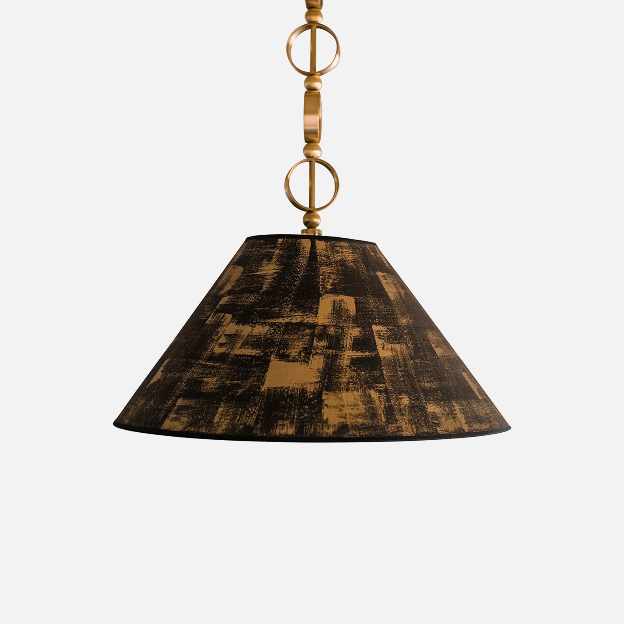 a brown and black lamp hanging from a ceiling