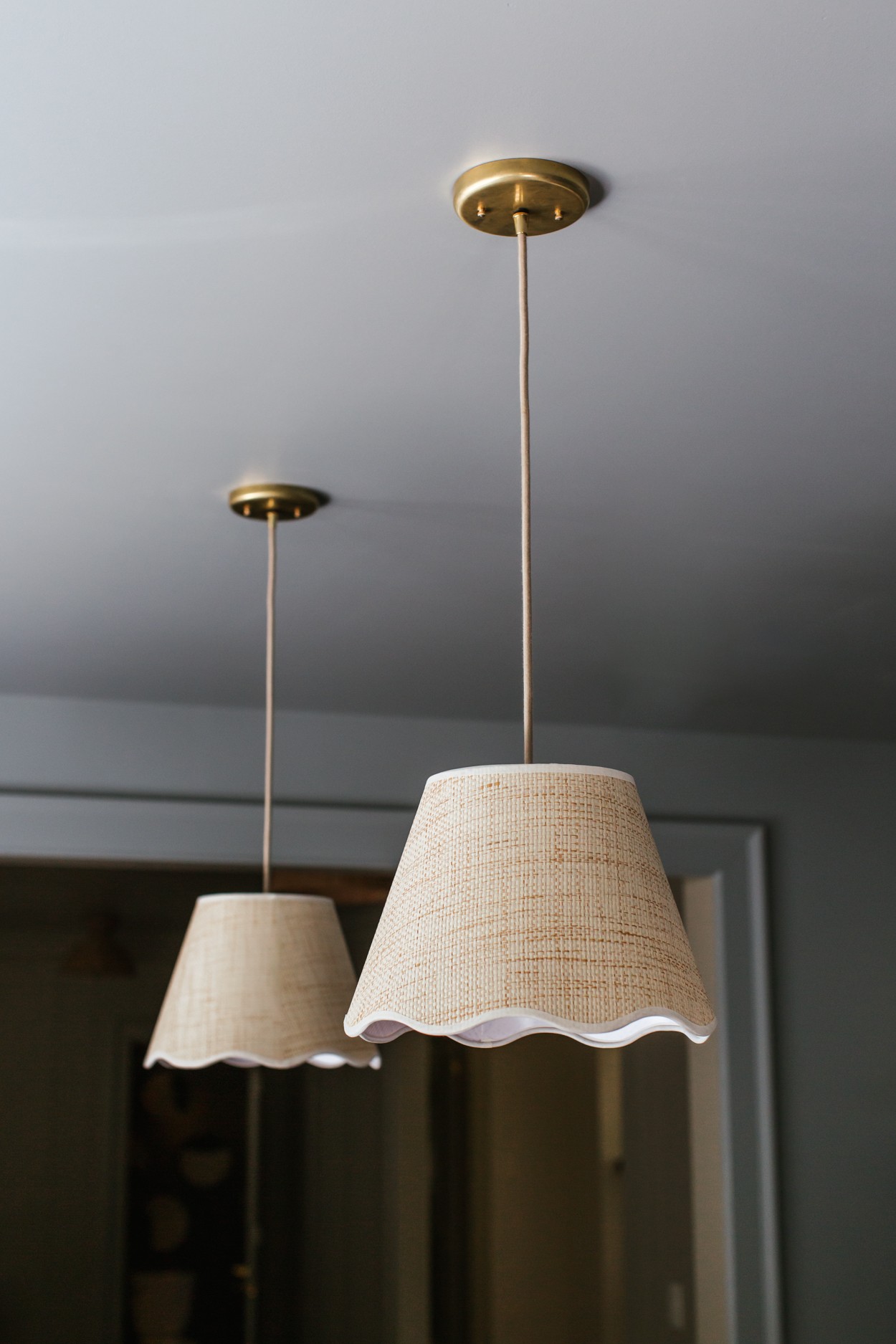 a couple of lamps hanging from a ceiling