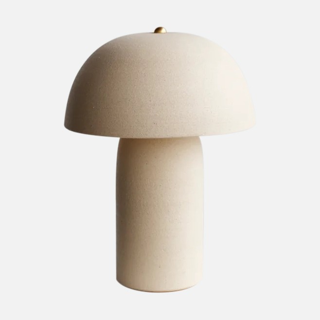 a white mushroom shaped lamp on a white background