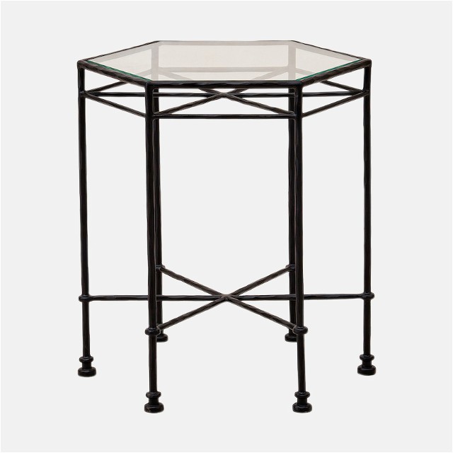 a glass and metal table with wheels on it