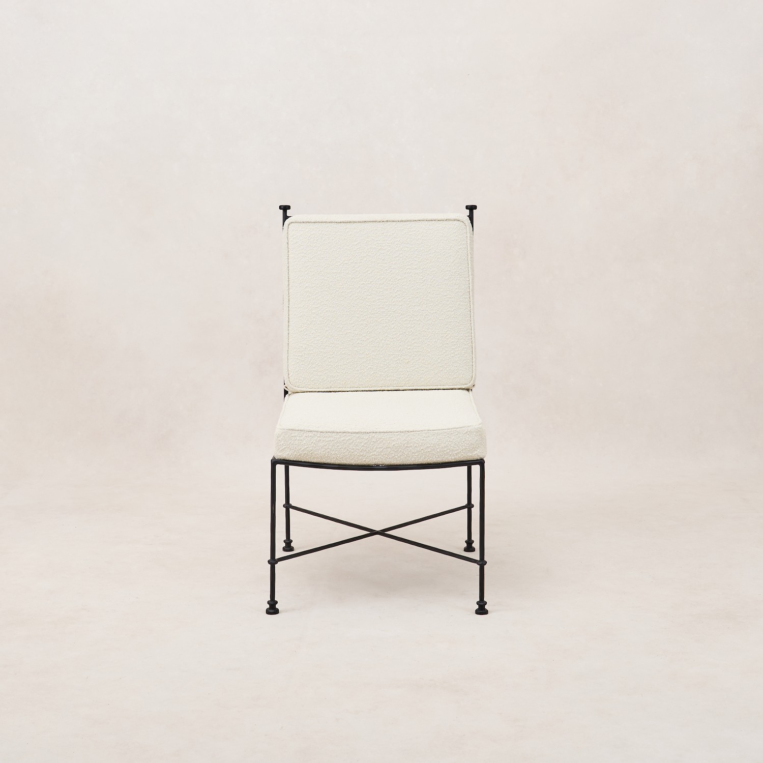 a white chair with a black frame on a white background