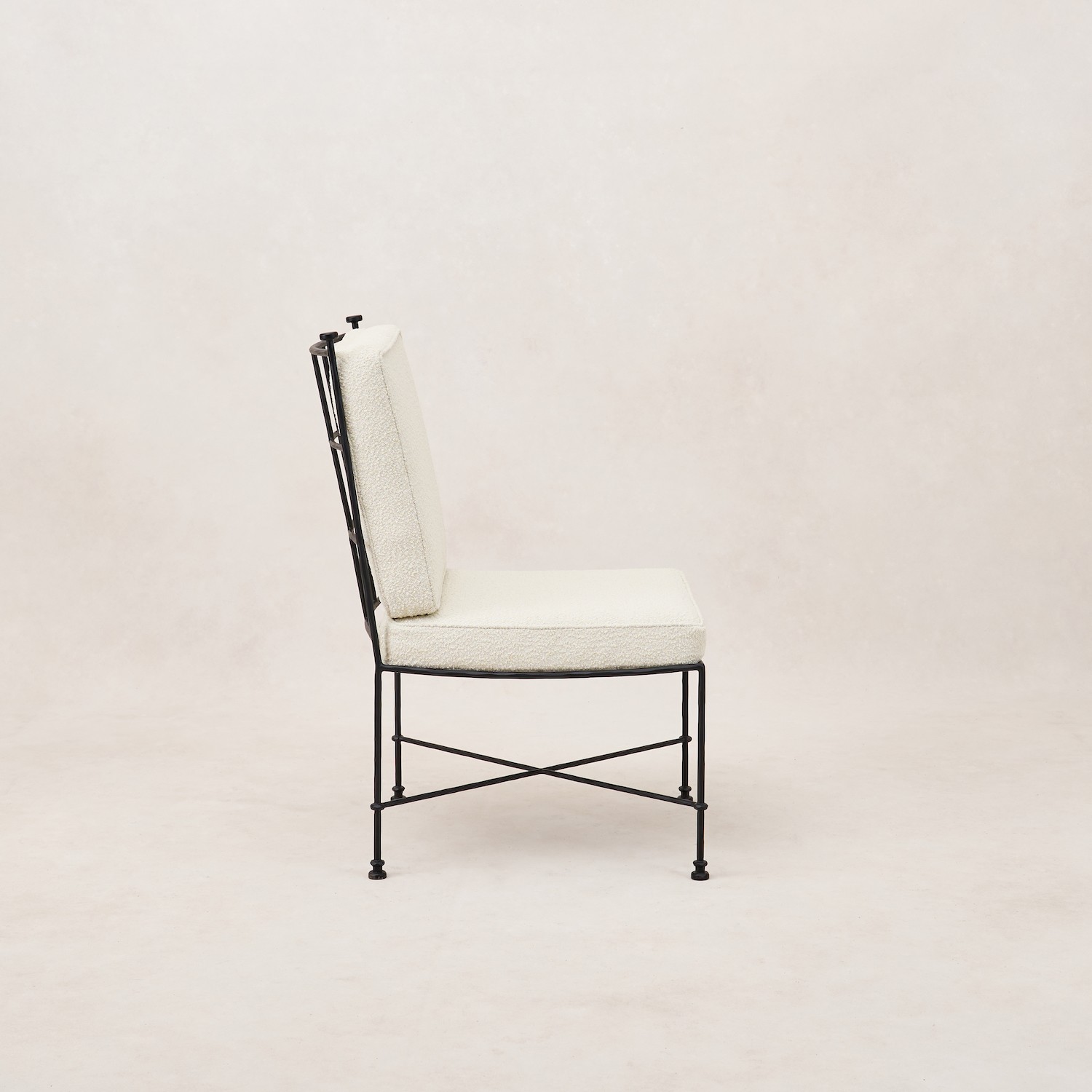 a black and white chair with a white upholstered back