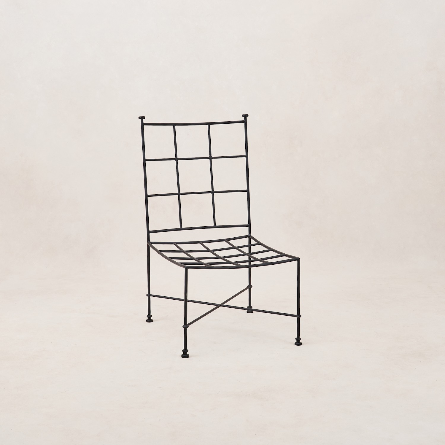 a black metal chair with a white background