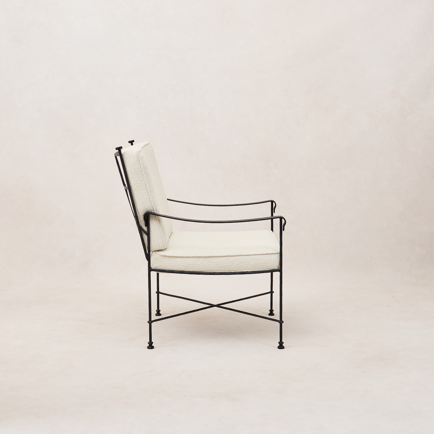 a black and white chair with a white upholstered seat