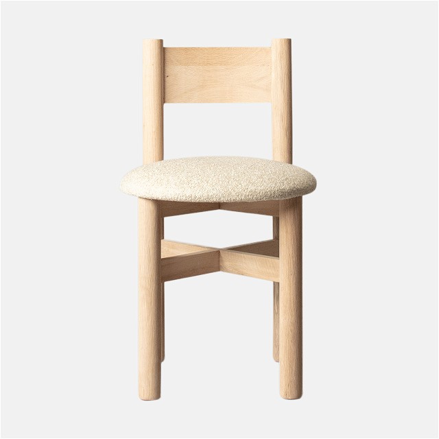 a wooden chair with a cushion on top of it