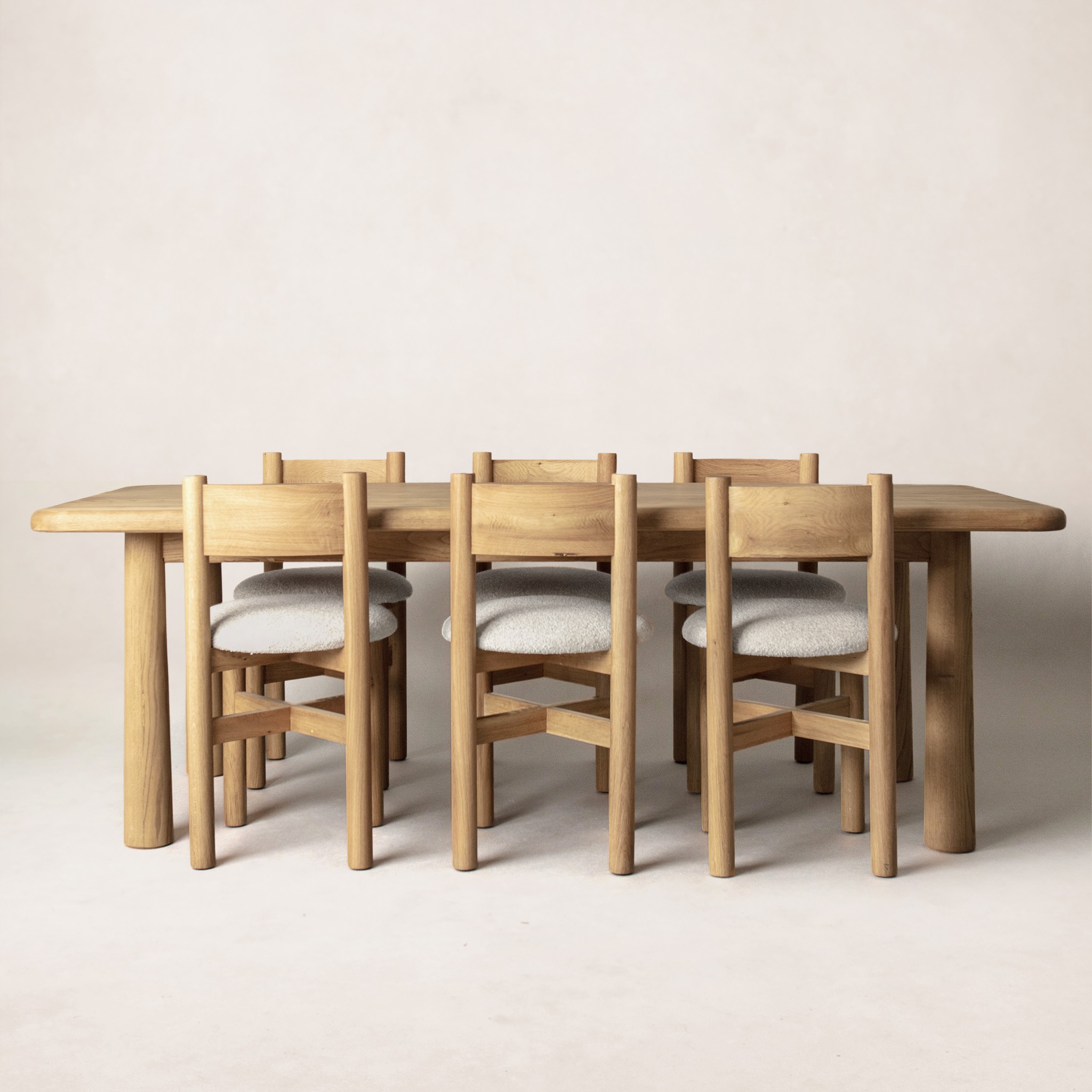 a wooden table with six chairs around it