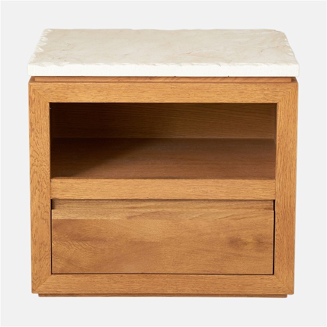 a small wooden cabinet with a marble top