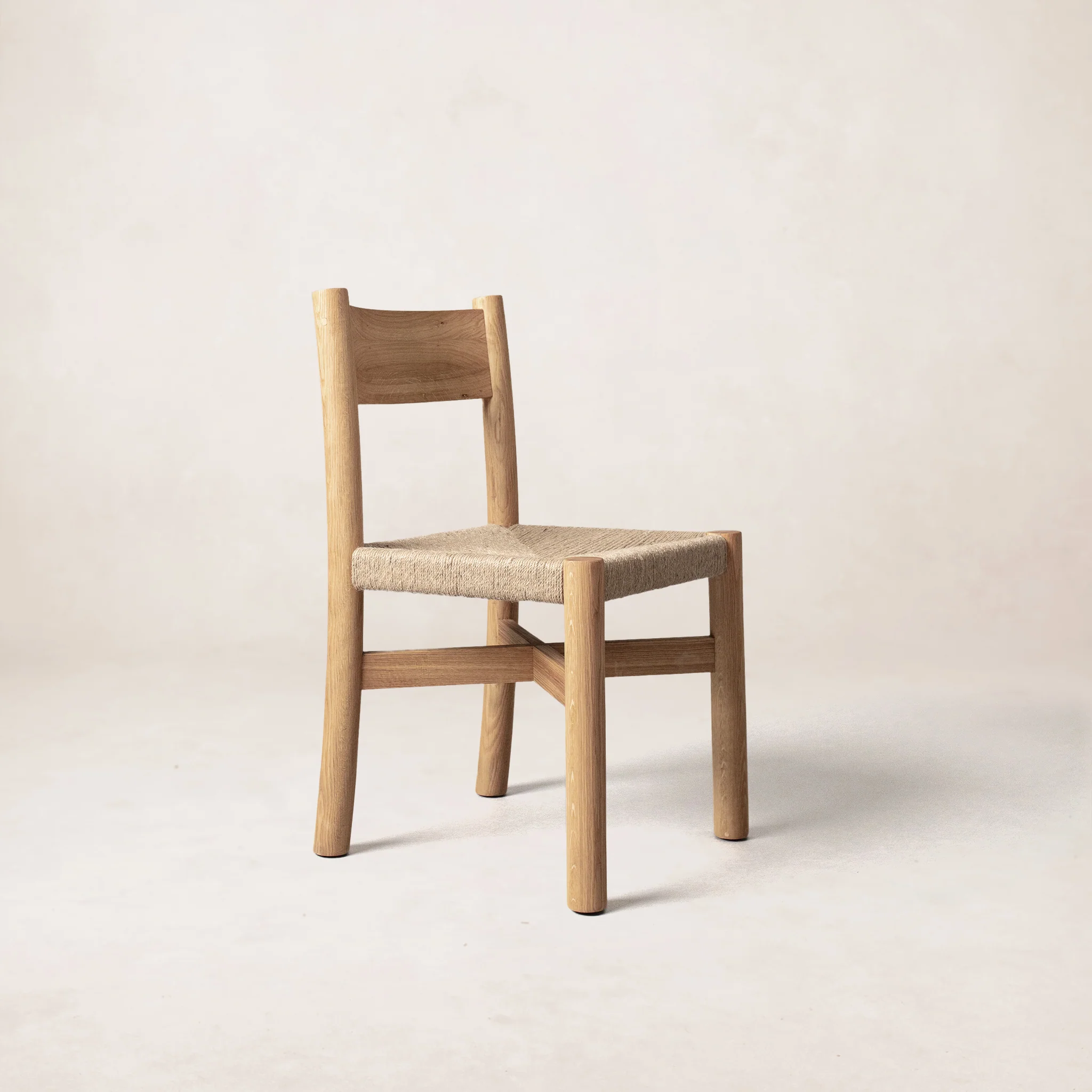 a wooden chair with a woven seat