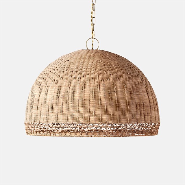 a rattan light hanging from a chain