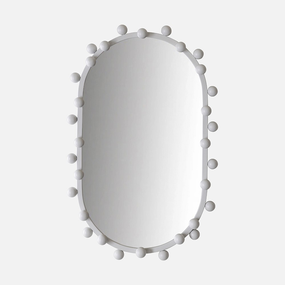 a white mirror with a bunch of balls on it