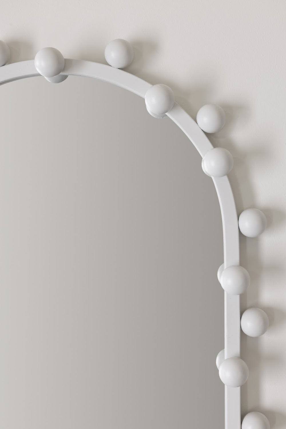 a mirror that has some balls on it