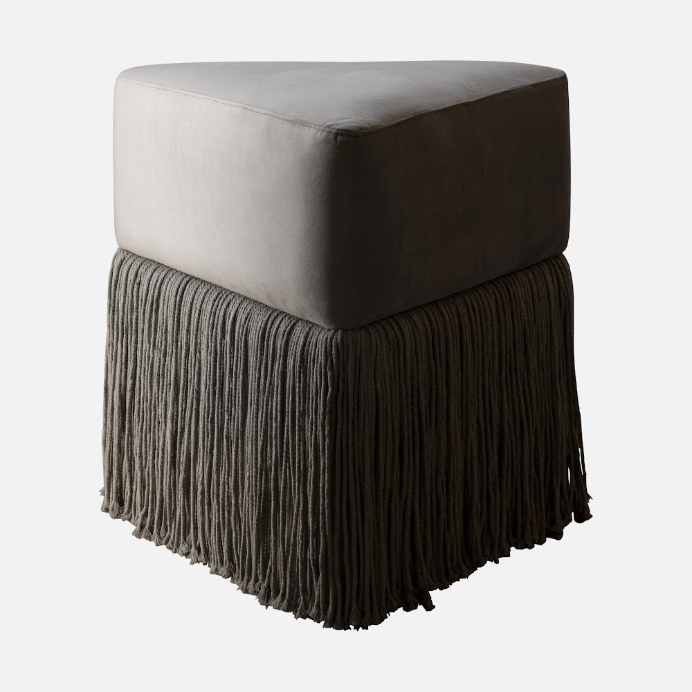 a foot stool with a fringe on it
