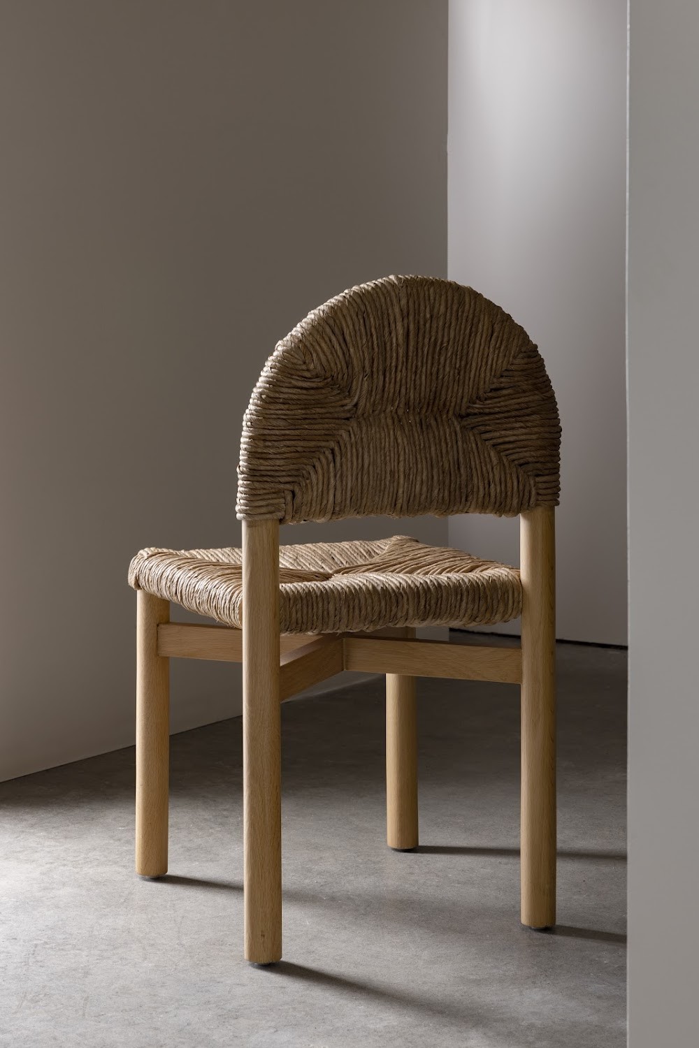 a wooden chair with a woven seat and back