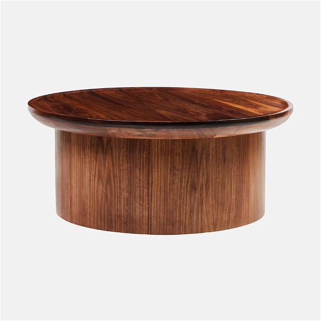 a round wooden table with a wooden top