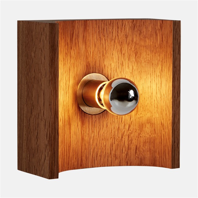 a wooden door with a light on it