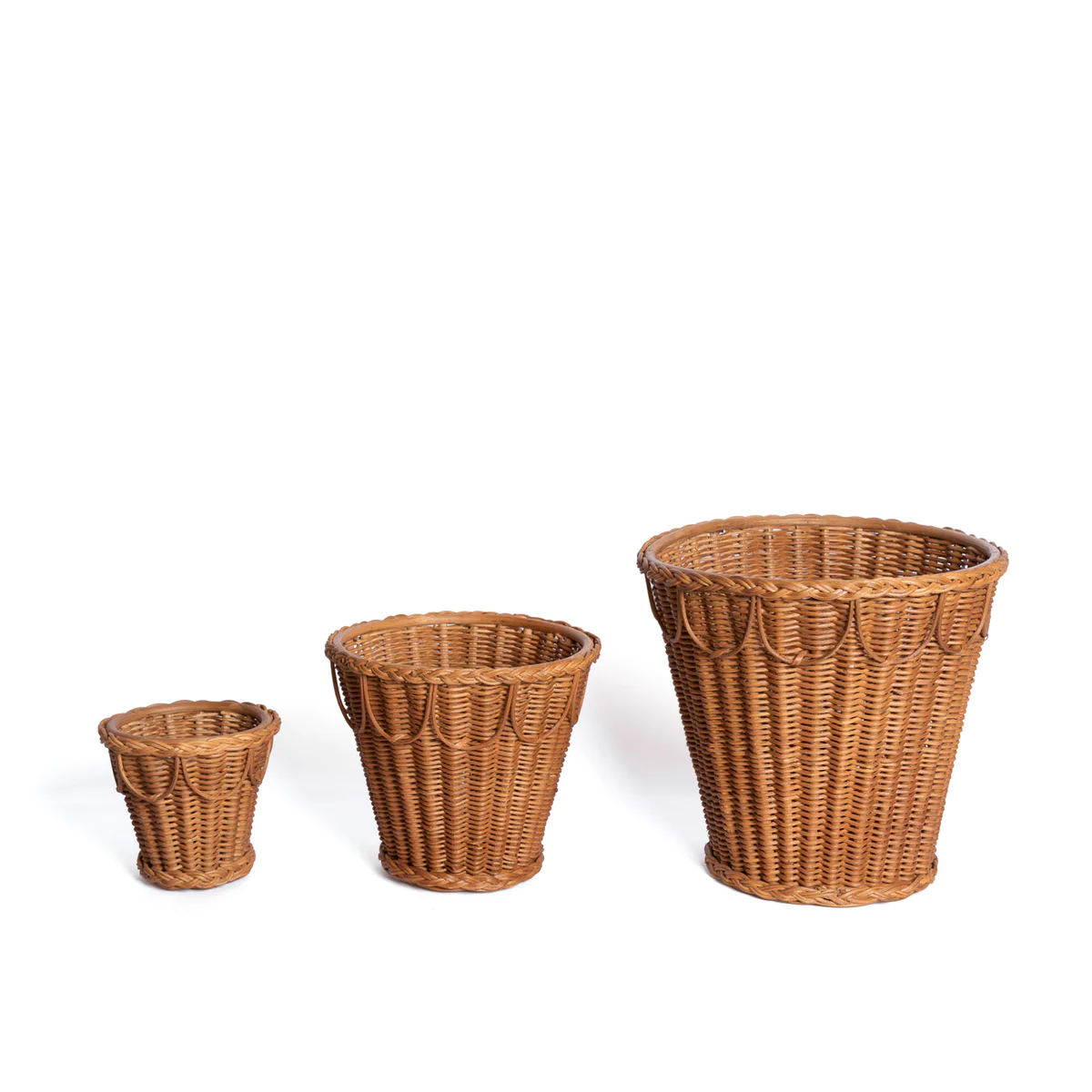 three wicker baskets sitting next to each other