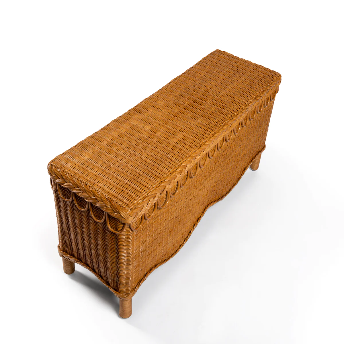 a wicker bench on a white background