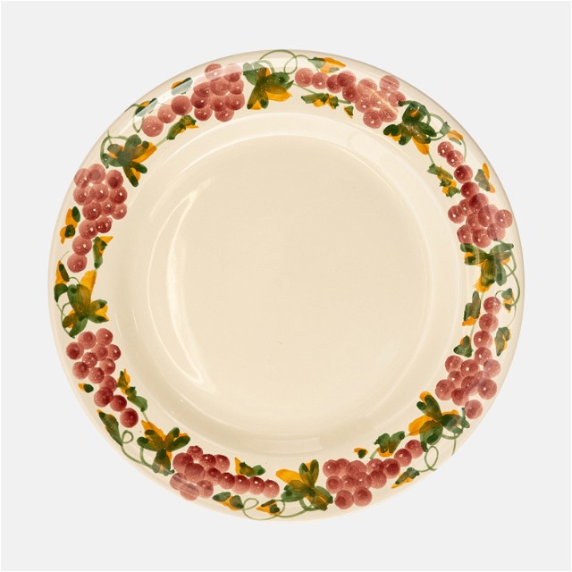 a white plate with red flowers on it
