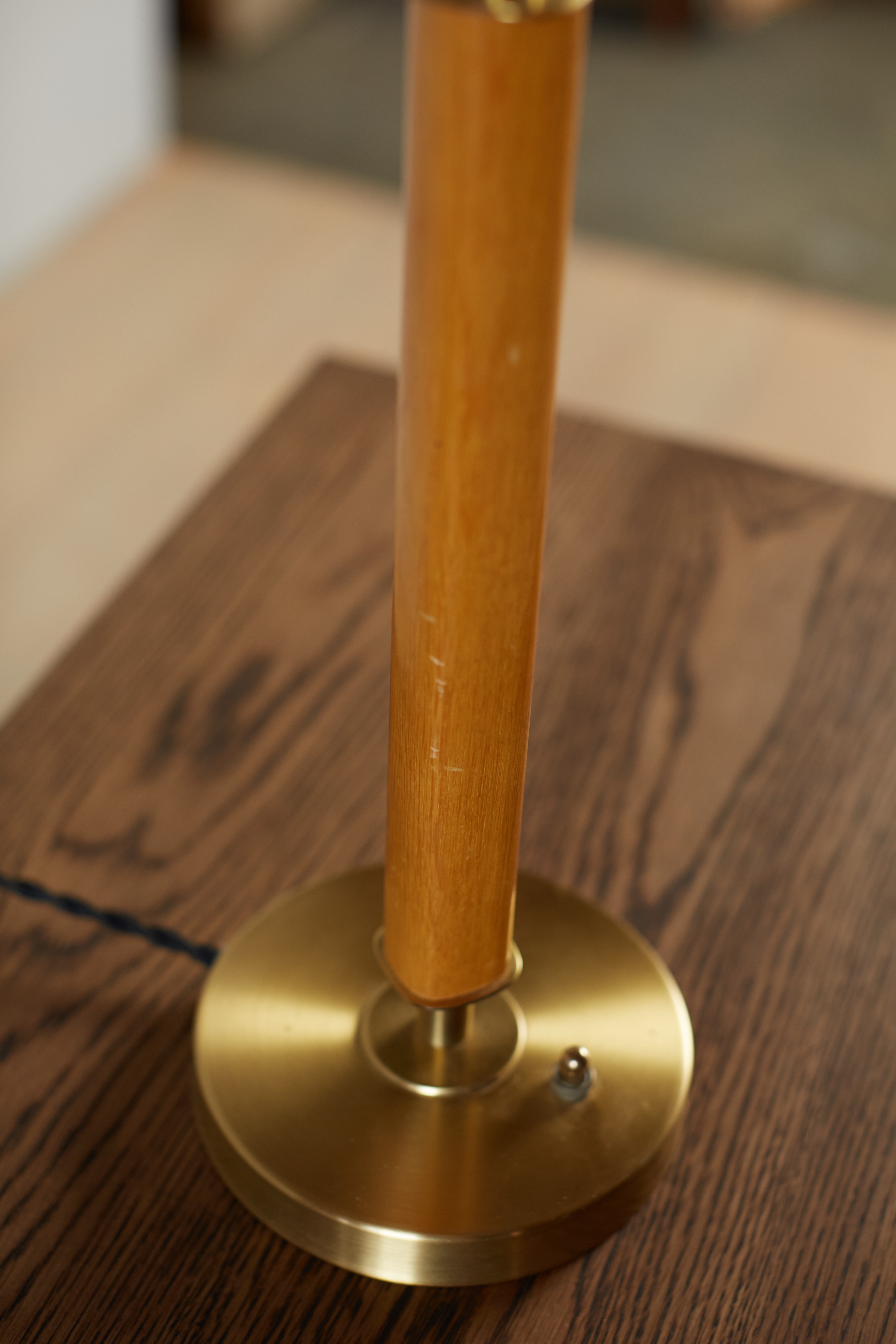 a close up of a wooden table with a metal base