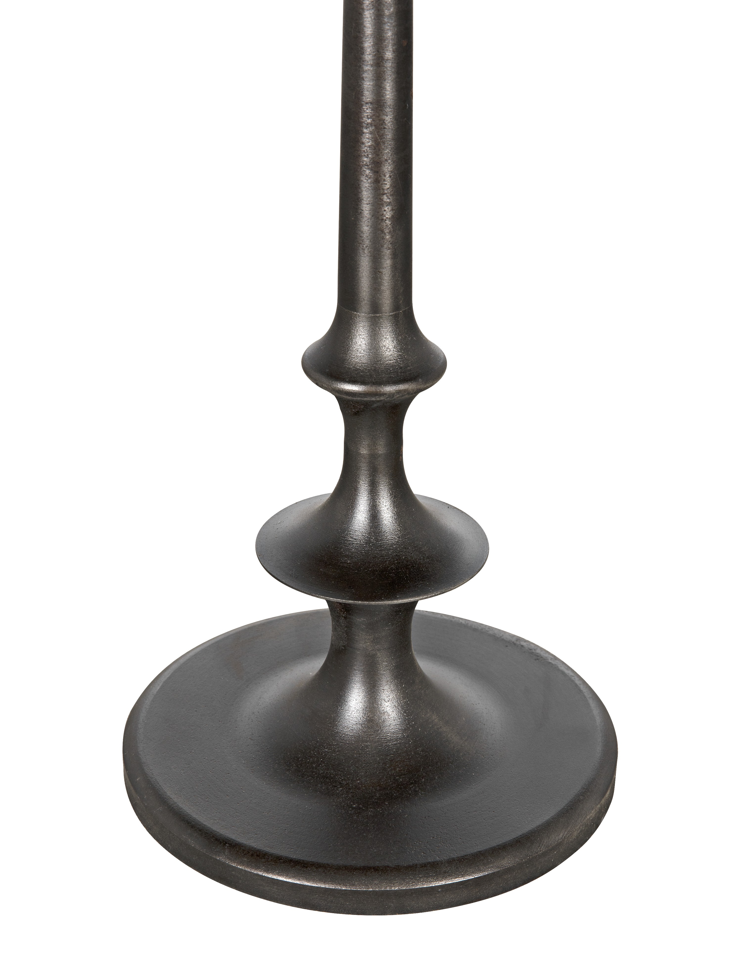 a tall metal pole with a black base