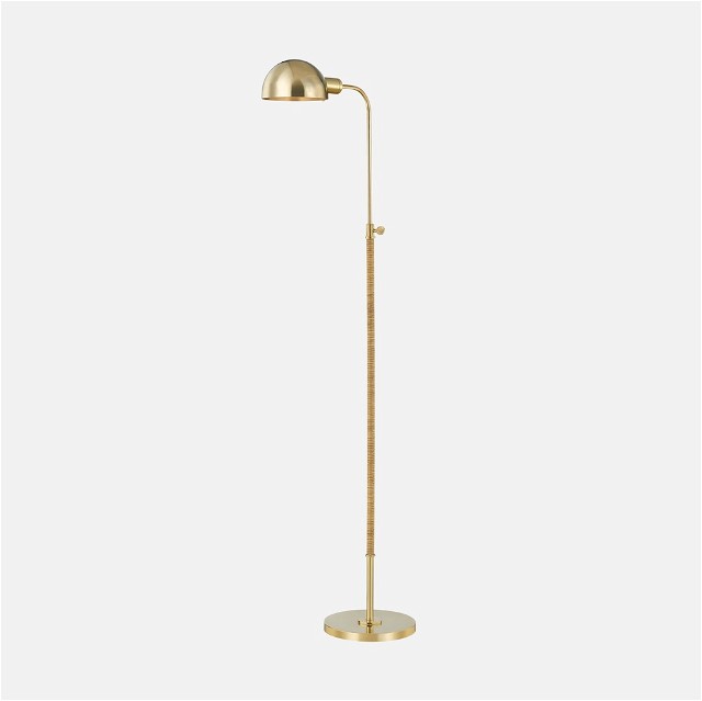 a brass floor lamp with a white background