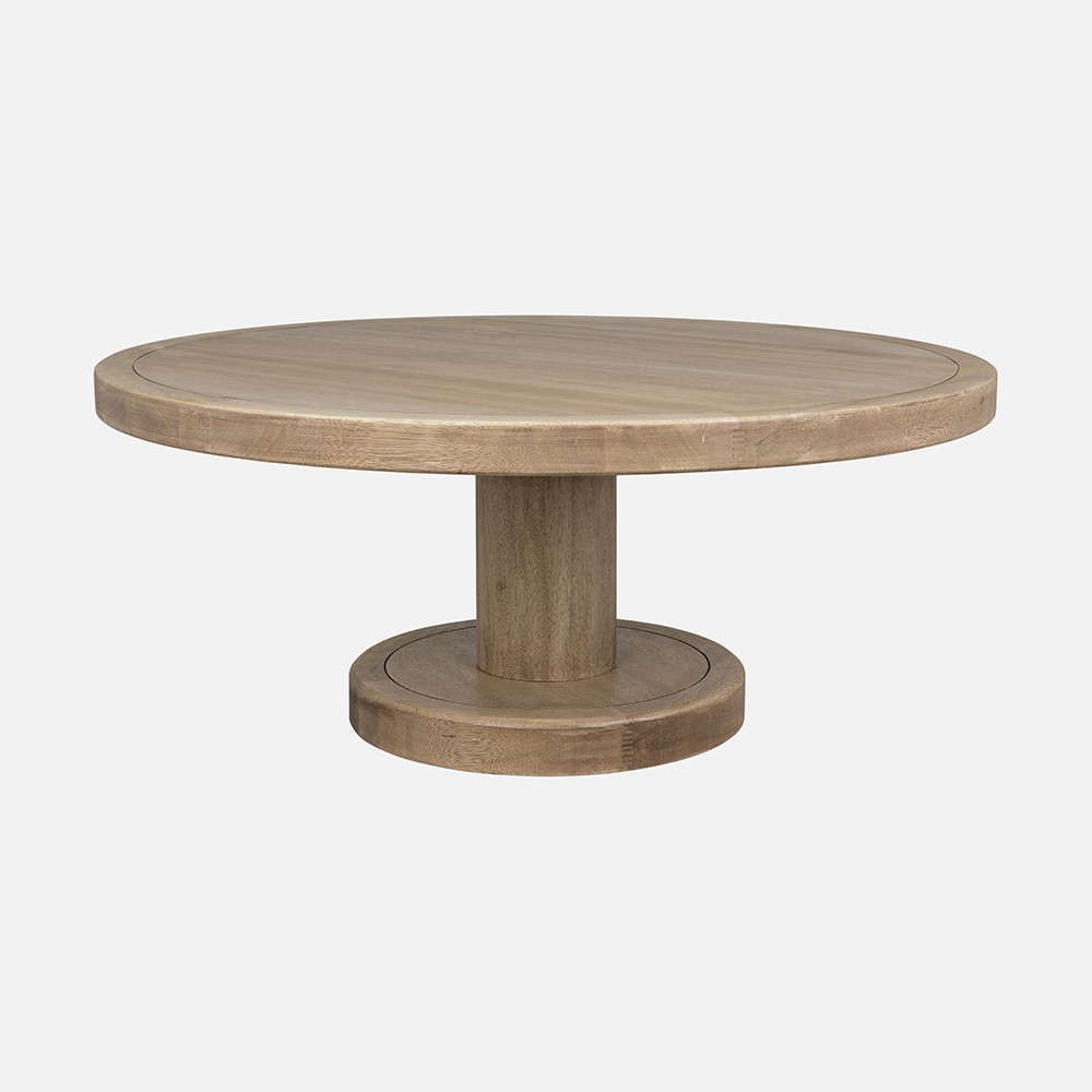 a round wooden table with a wooden base