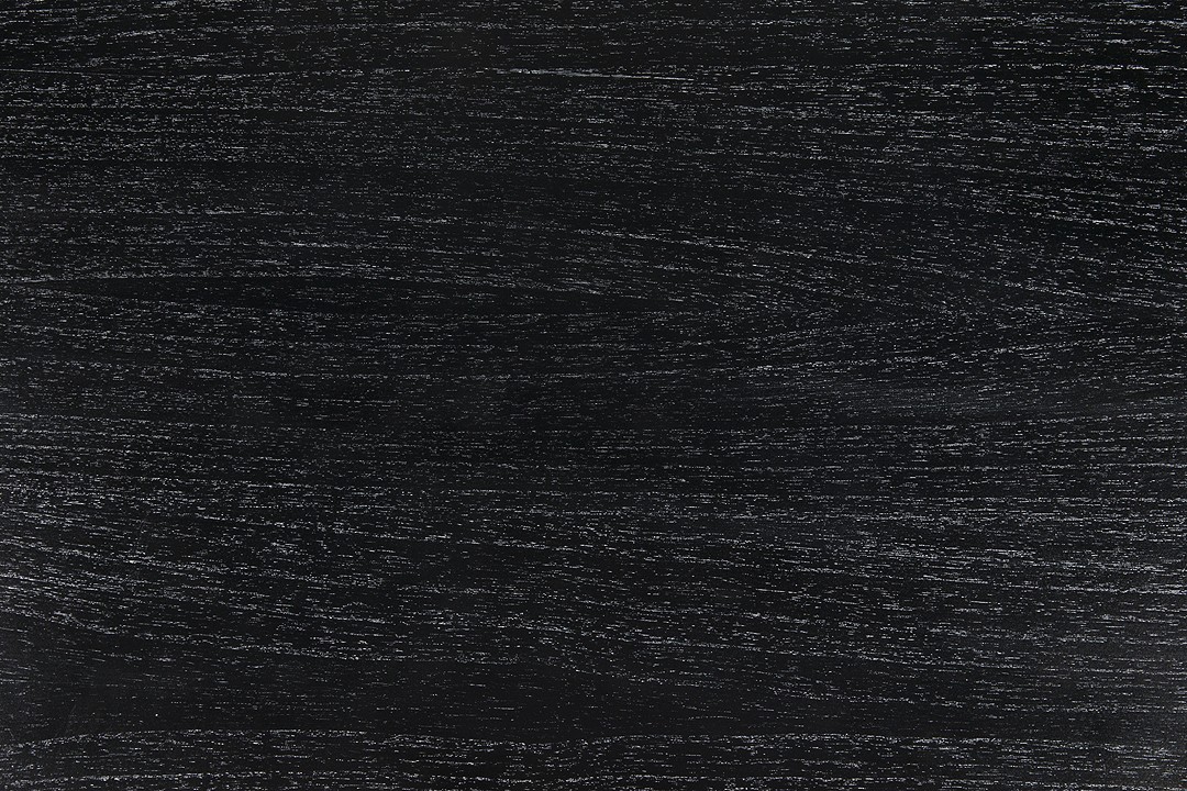 a close up of a black wood grain background