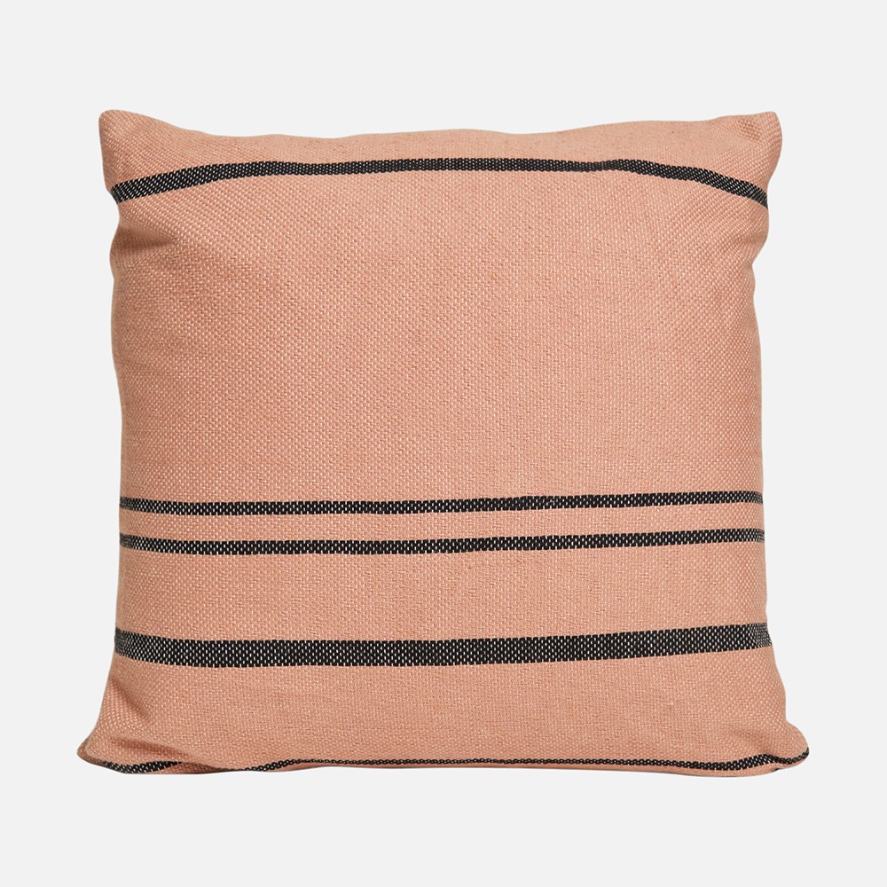 a pink and black striped pillow on a white background