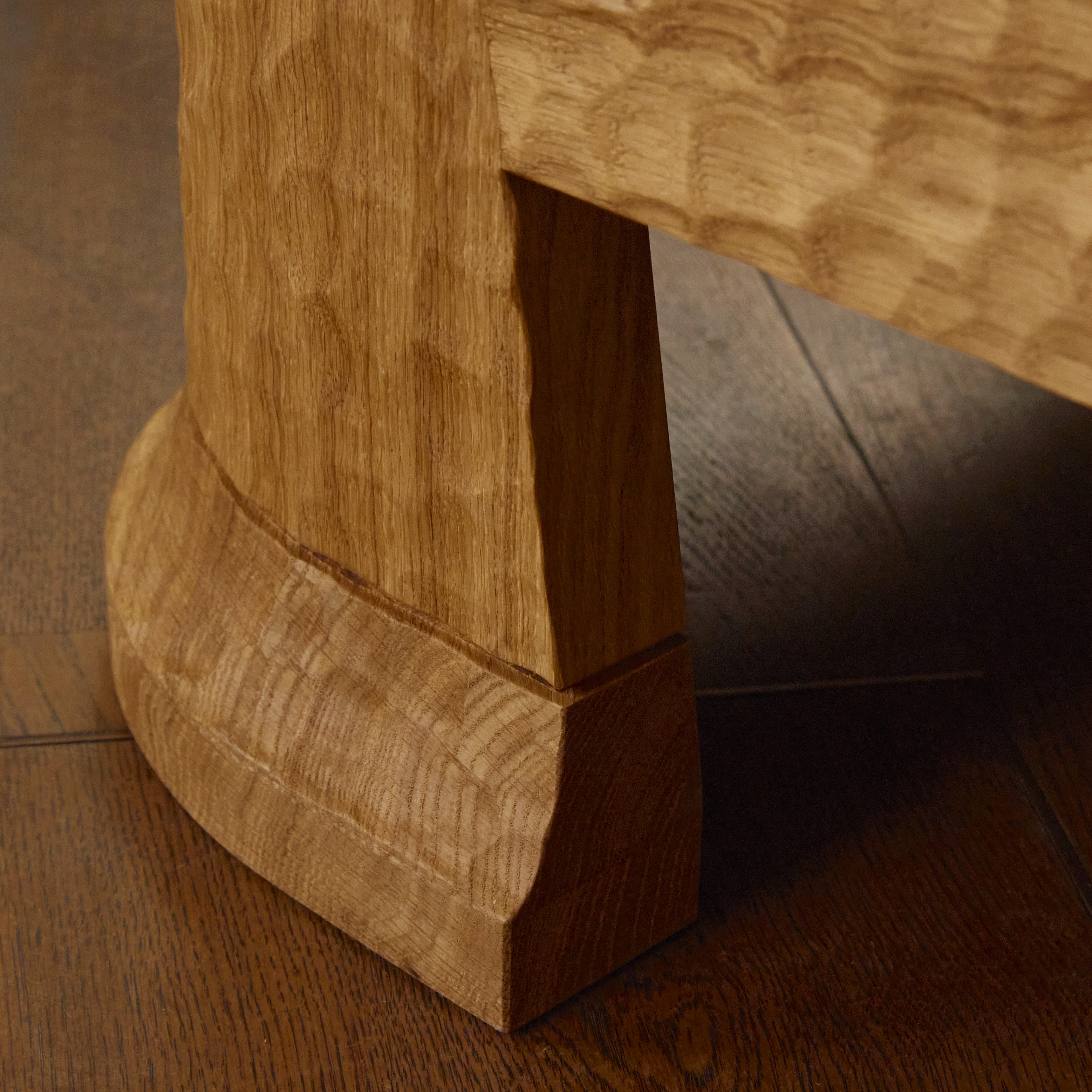 a close up of a wooden bench on a wooden floor