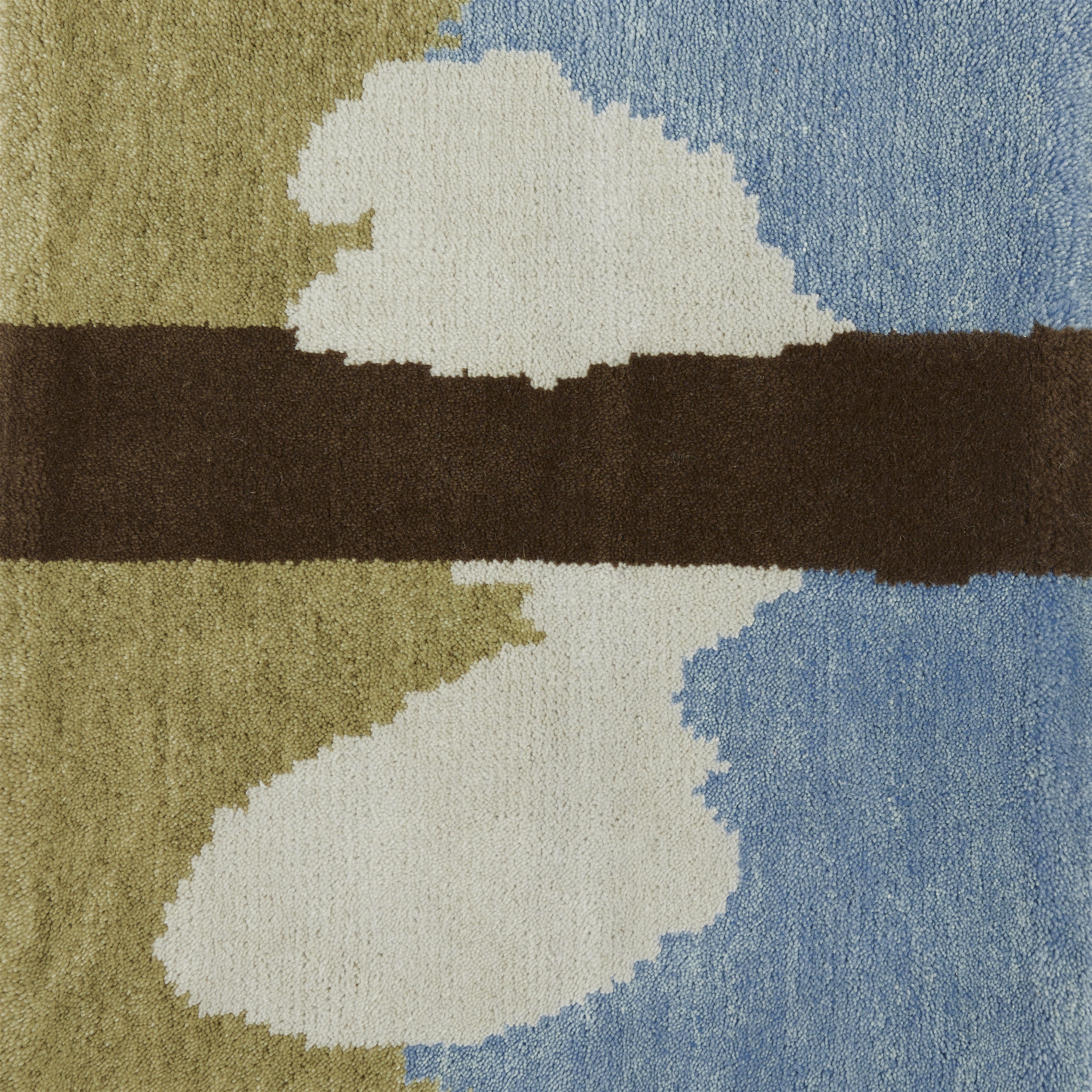 a rug with a blue, green, brown and white design