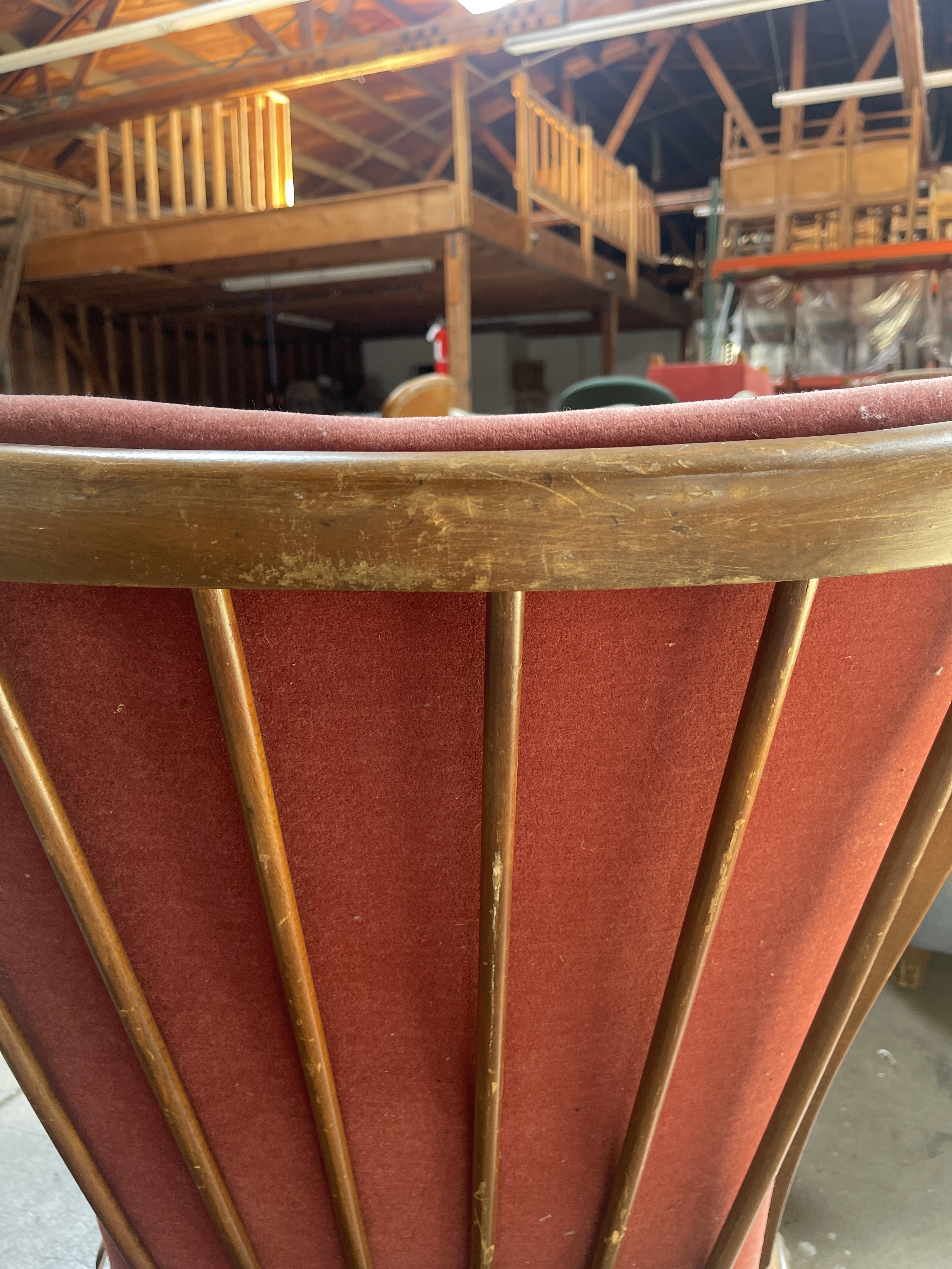 a close up of a red and gold chair