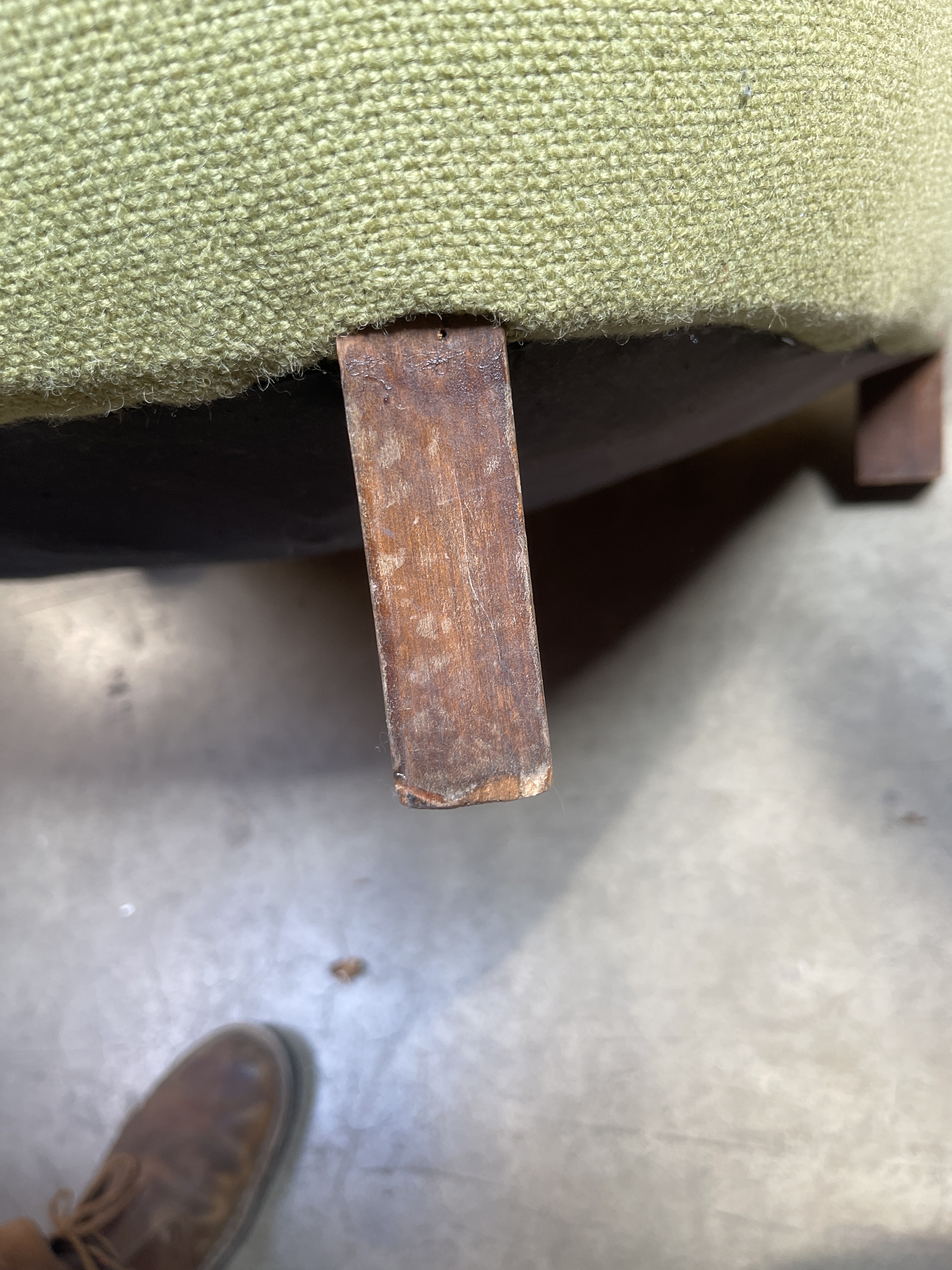 a piece of wood sticking out of the back of a chair