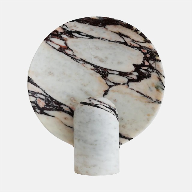 a white and black marble plate on a white background