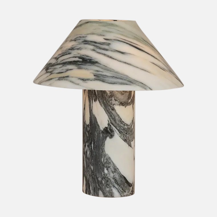a marble lamp with a black and white shade