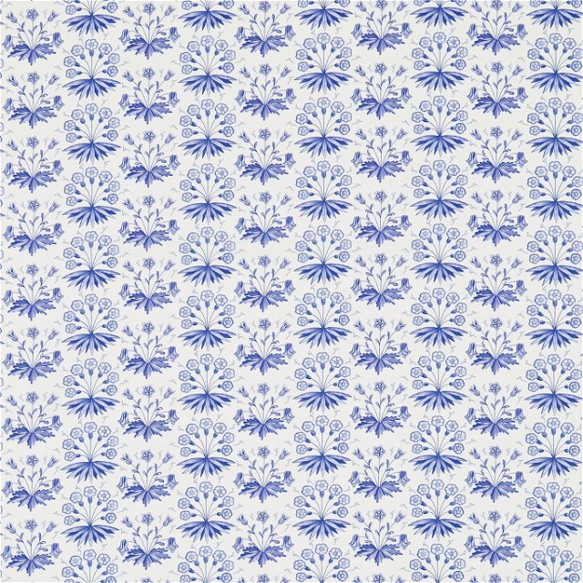 a blue and white flower pattern on a white background