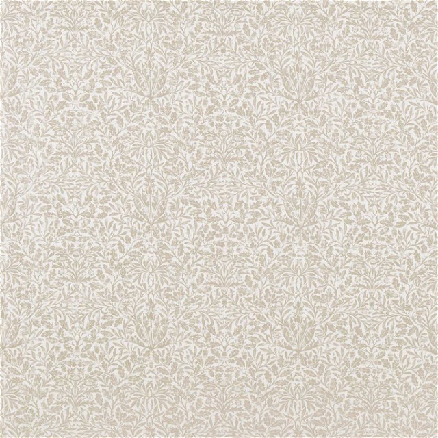 a white rug with a pattern of leaves on it
