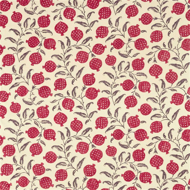a red and white fabric with berries on it