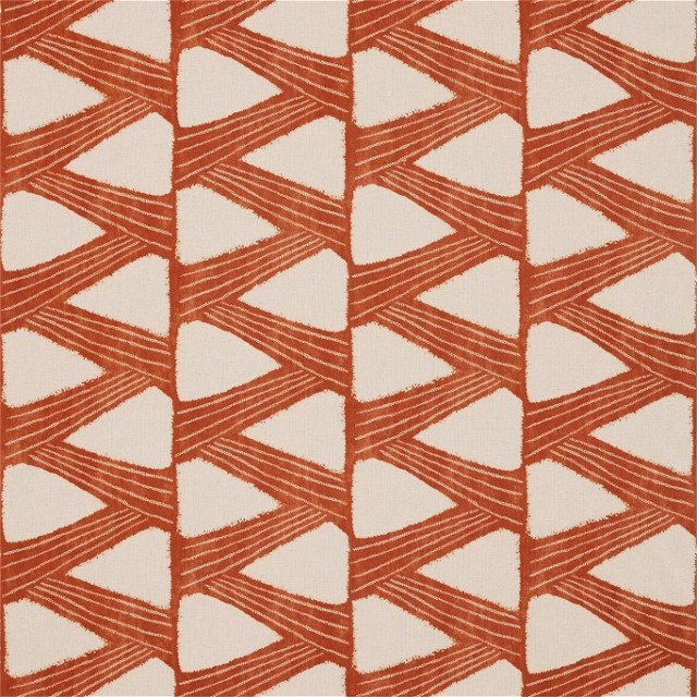 an orange and white rug with a pattern on it
