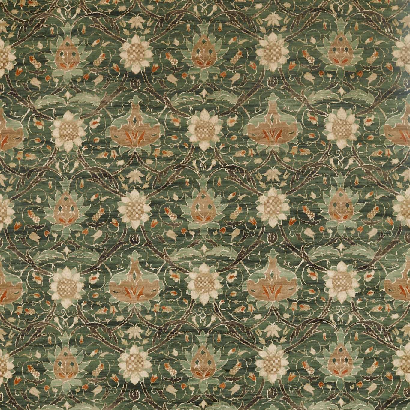 a green rug with a floral design on it