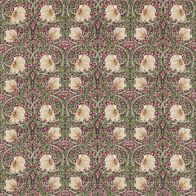a green and pink wallpaper with a flower pattern