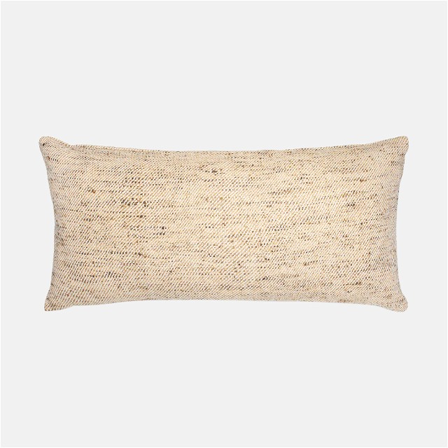 a beige pillow with a white background