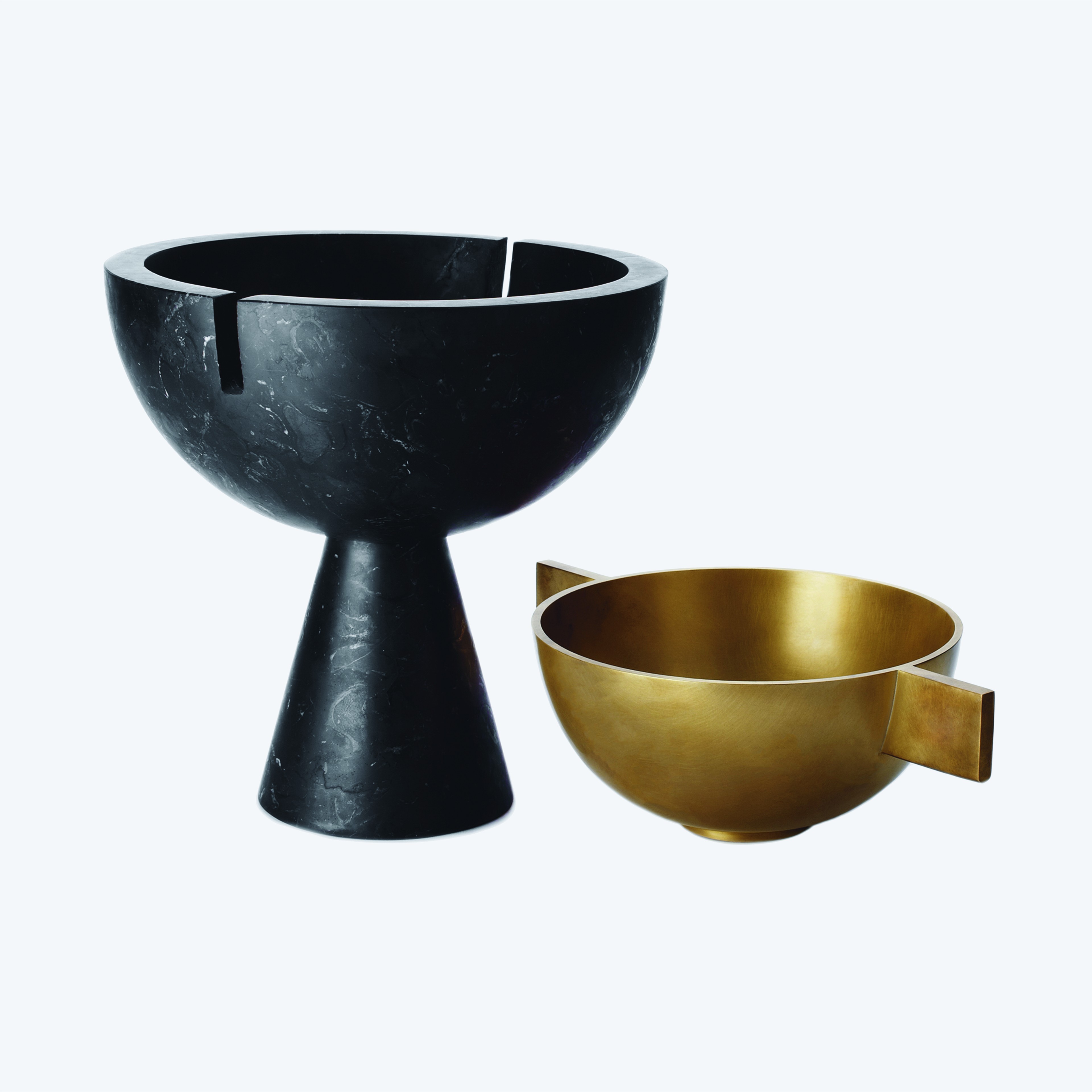 a black and gold bowl and a black and gold bowl