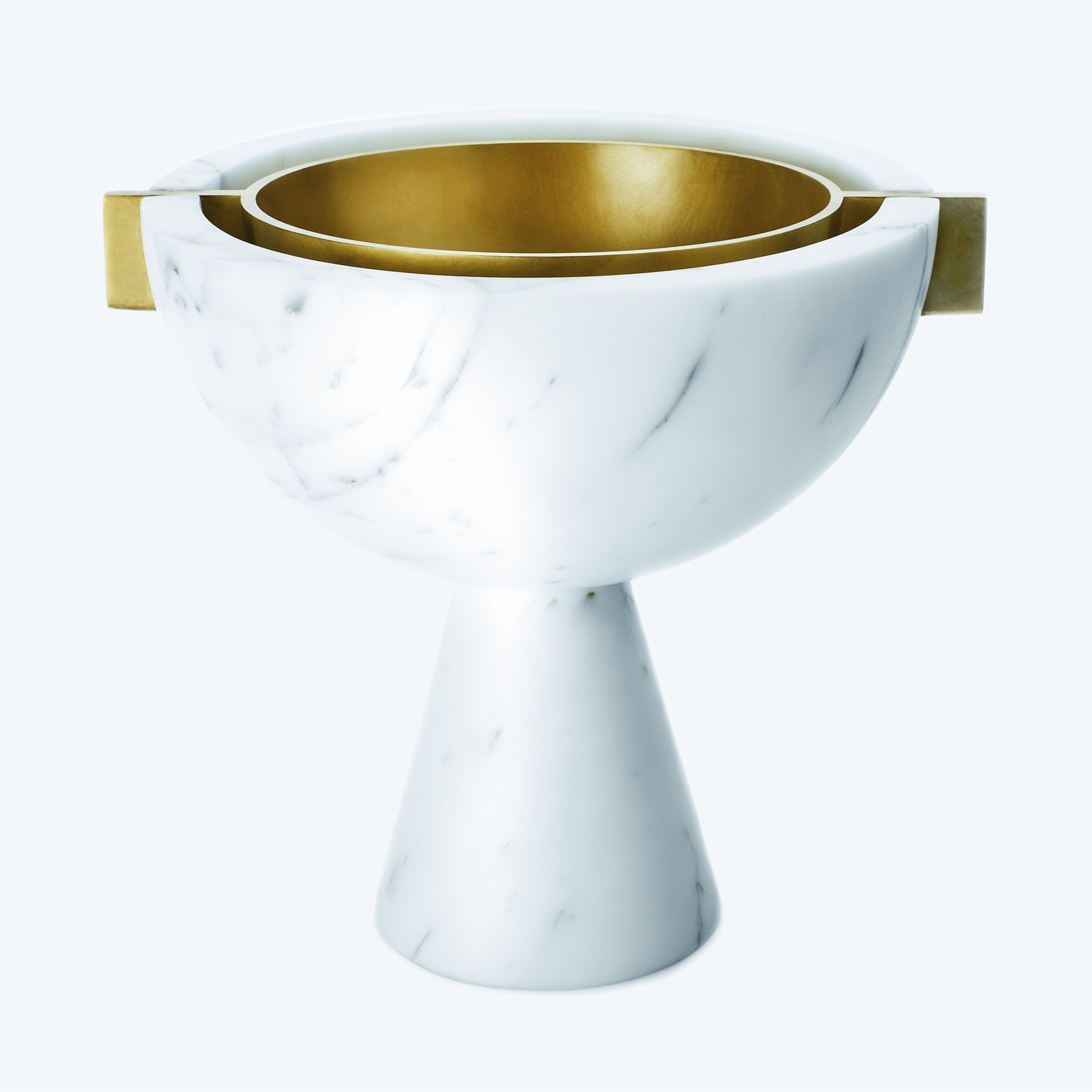 a white marble bowl with a gold rim