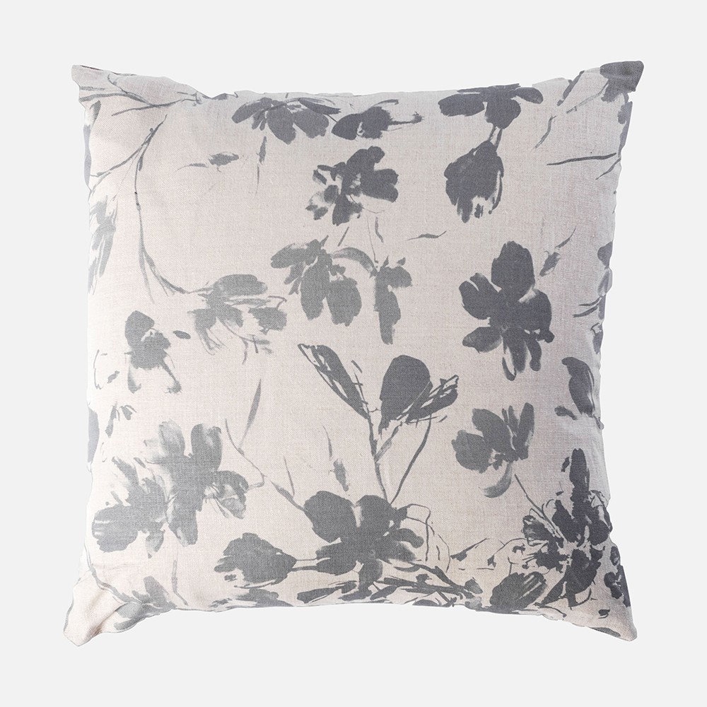 a black and white floral pillow on a white background