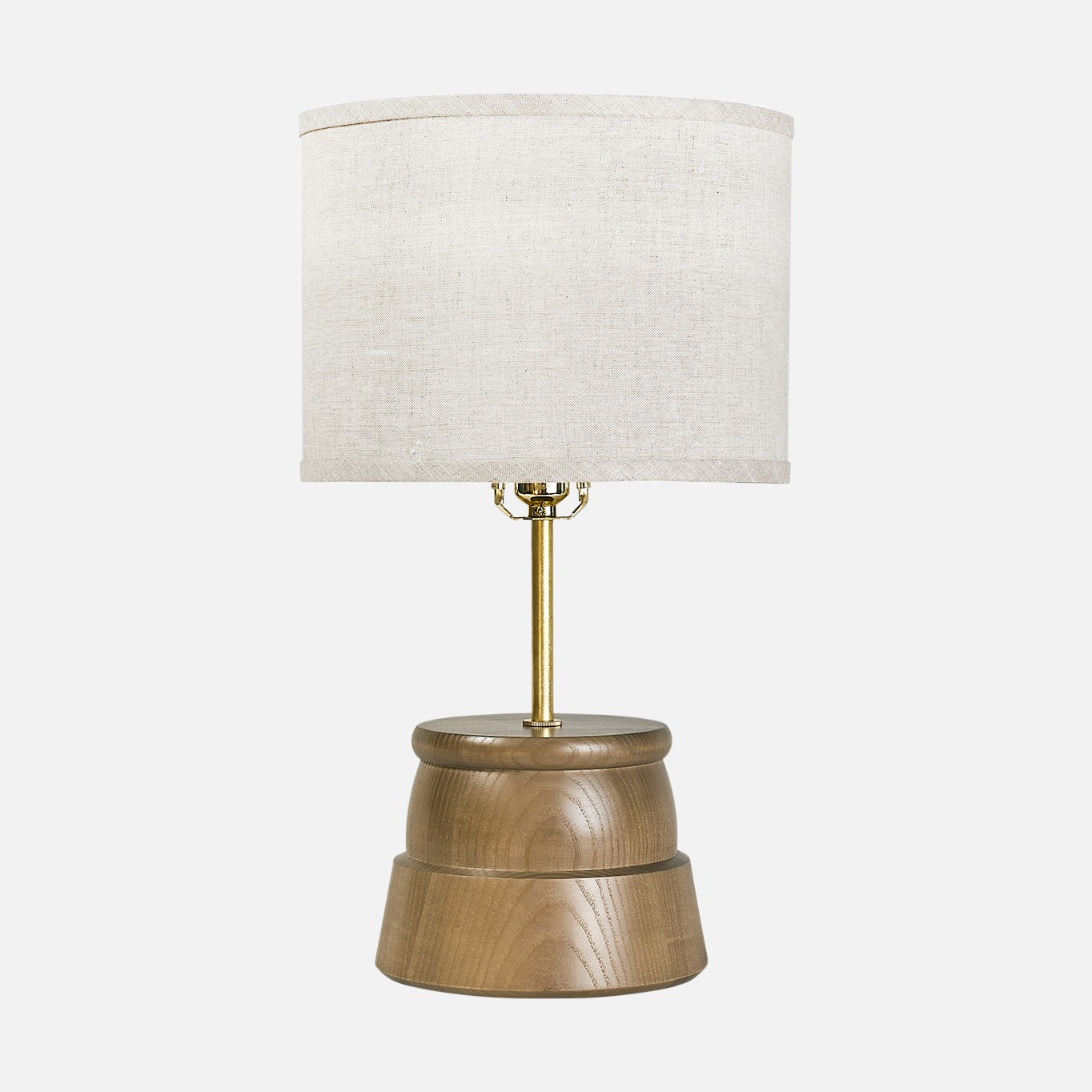 a wooden table lamp with a white shade
